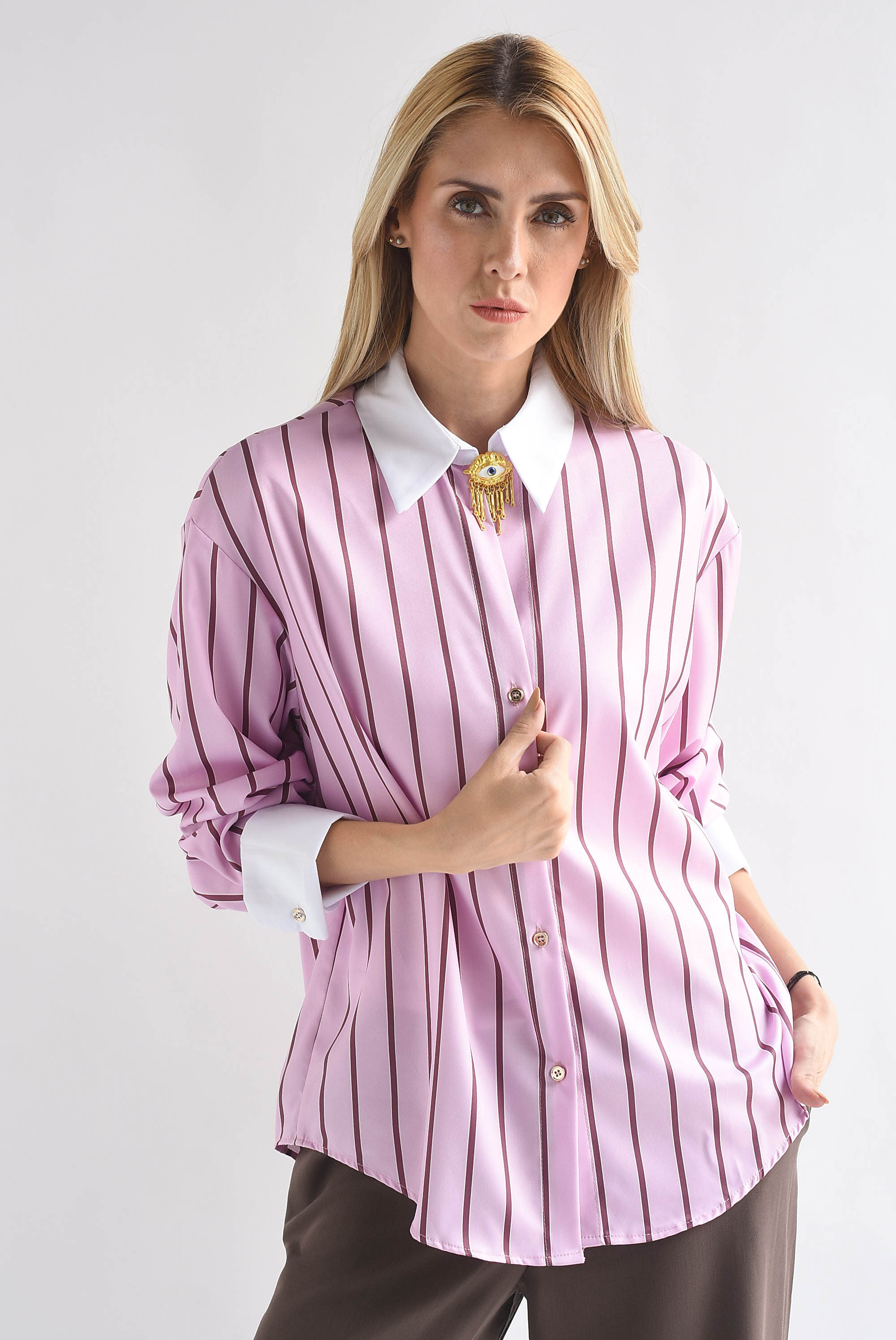 Camisa rayas broche ojo