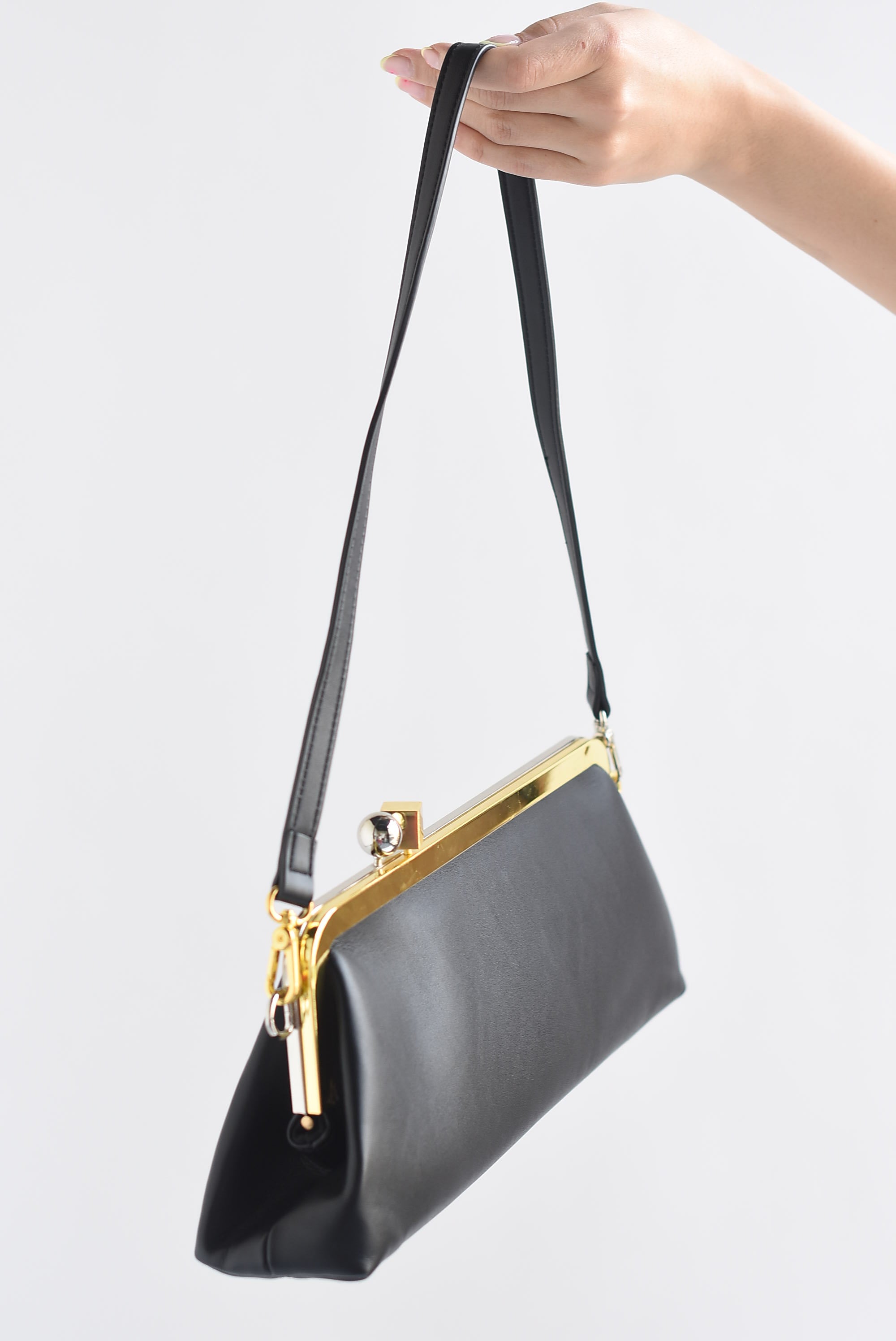 Bolso clutch broche dorado y plata