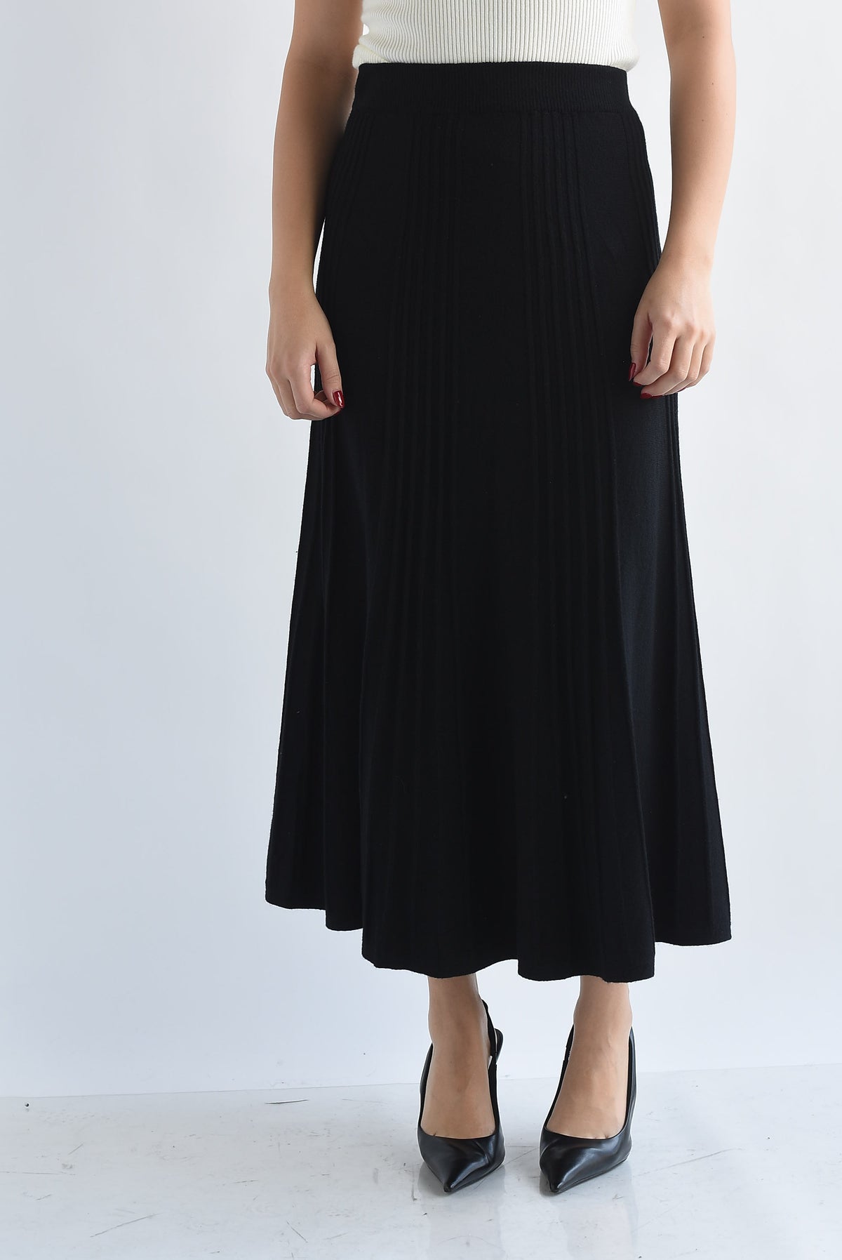 Falda midi punto plisada