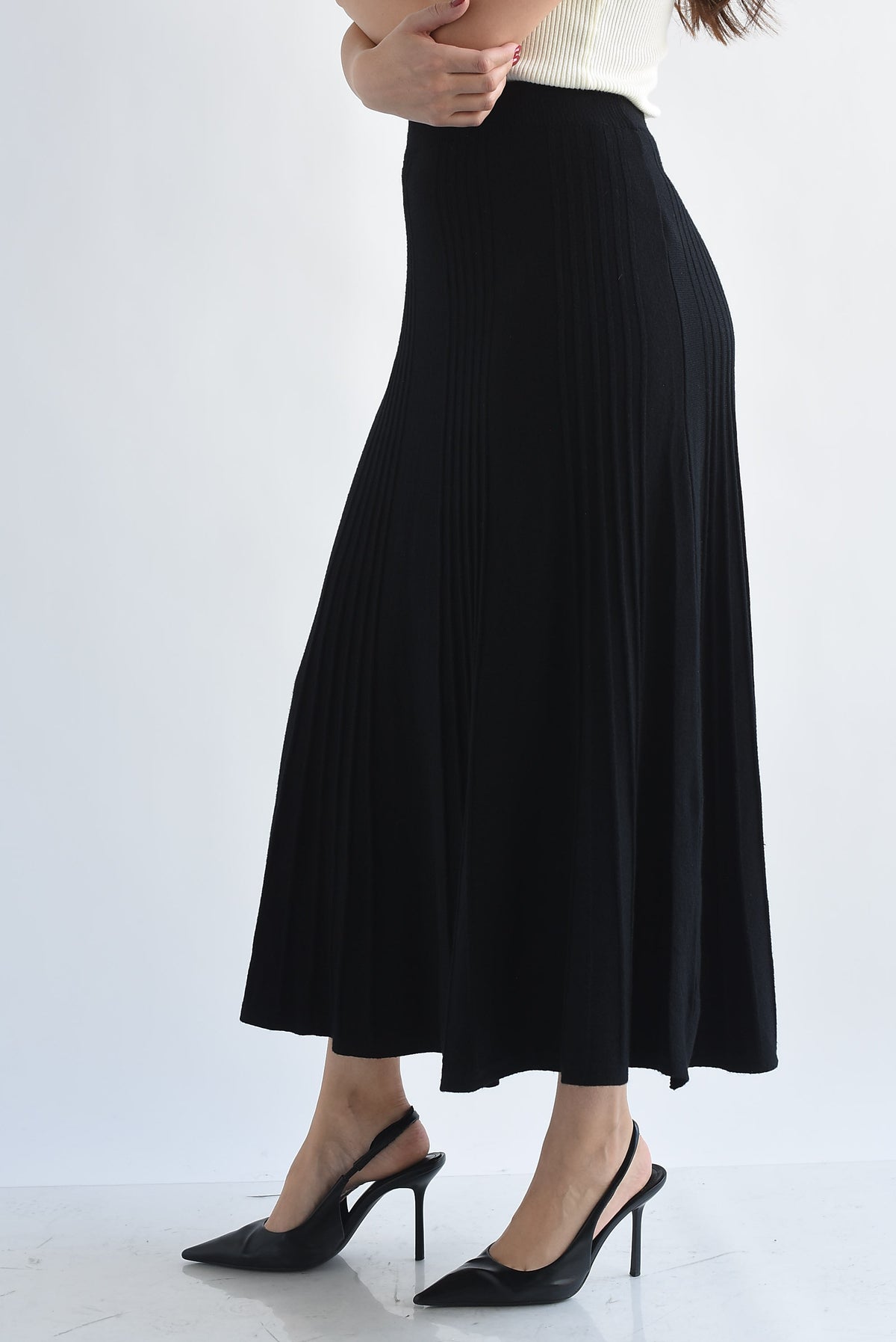 Falda midi punto plisada