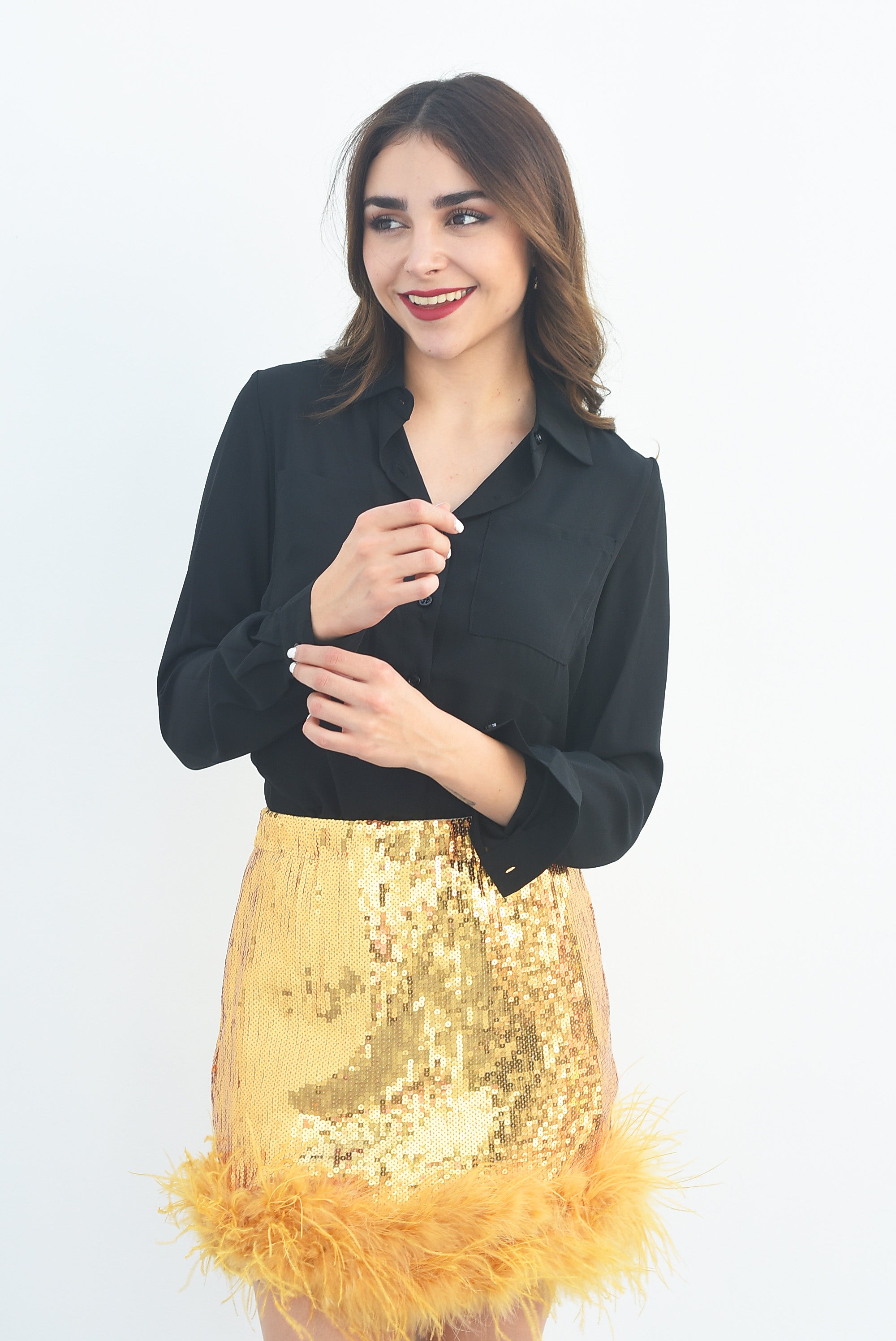 Falda corta lentejuela con plumas Dorada