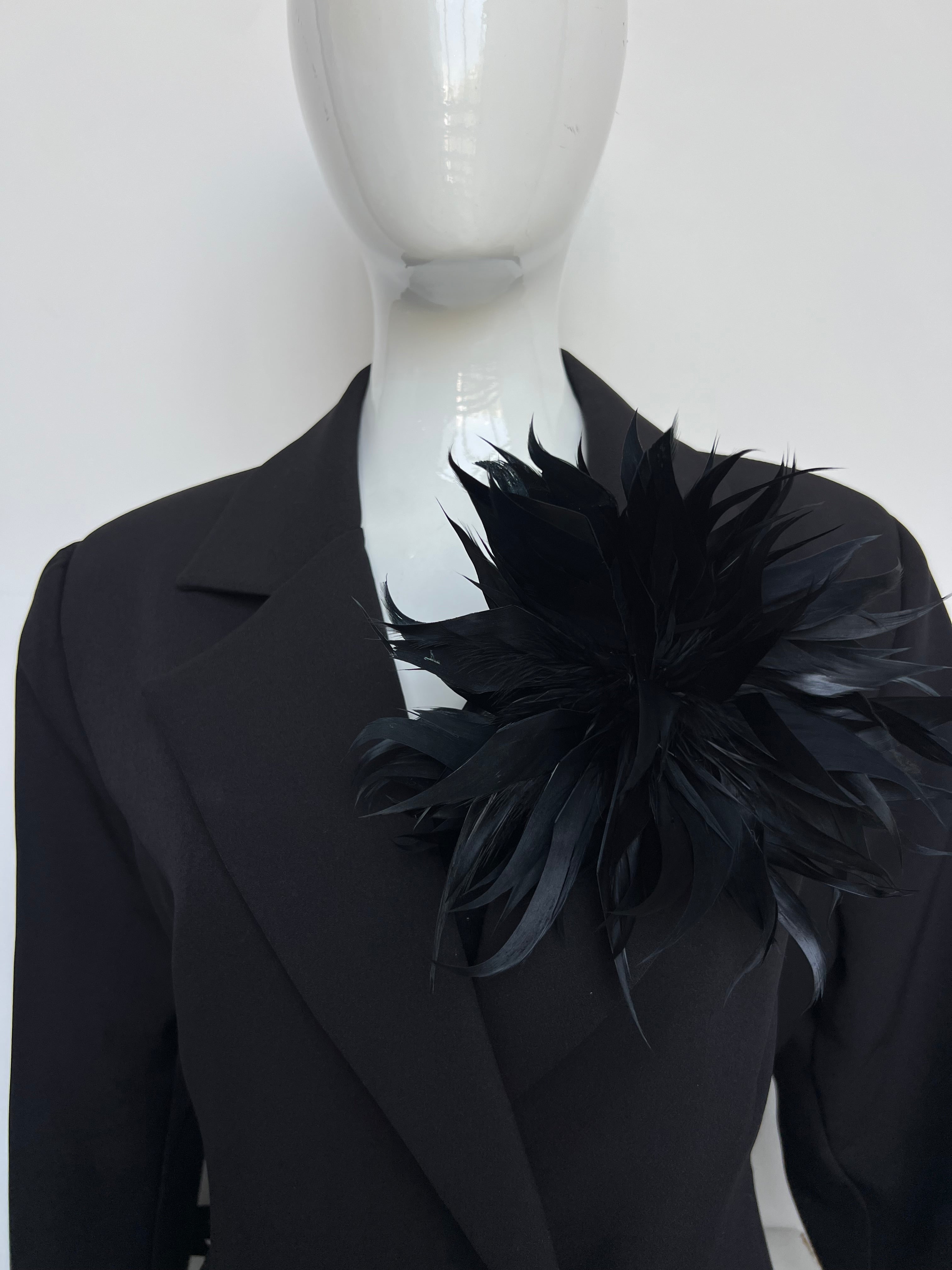 Broche plumas