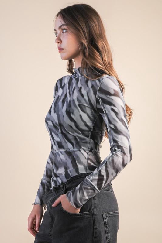 Blusa mesh costuras animal print
