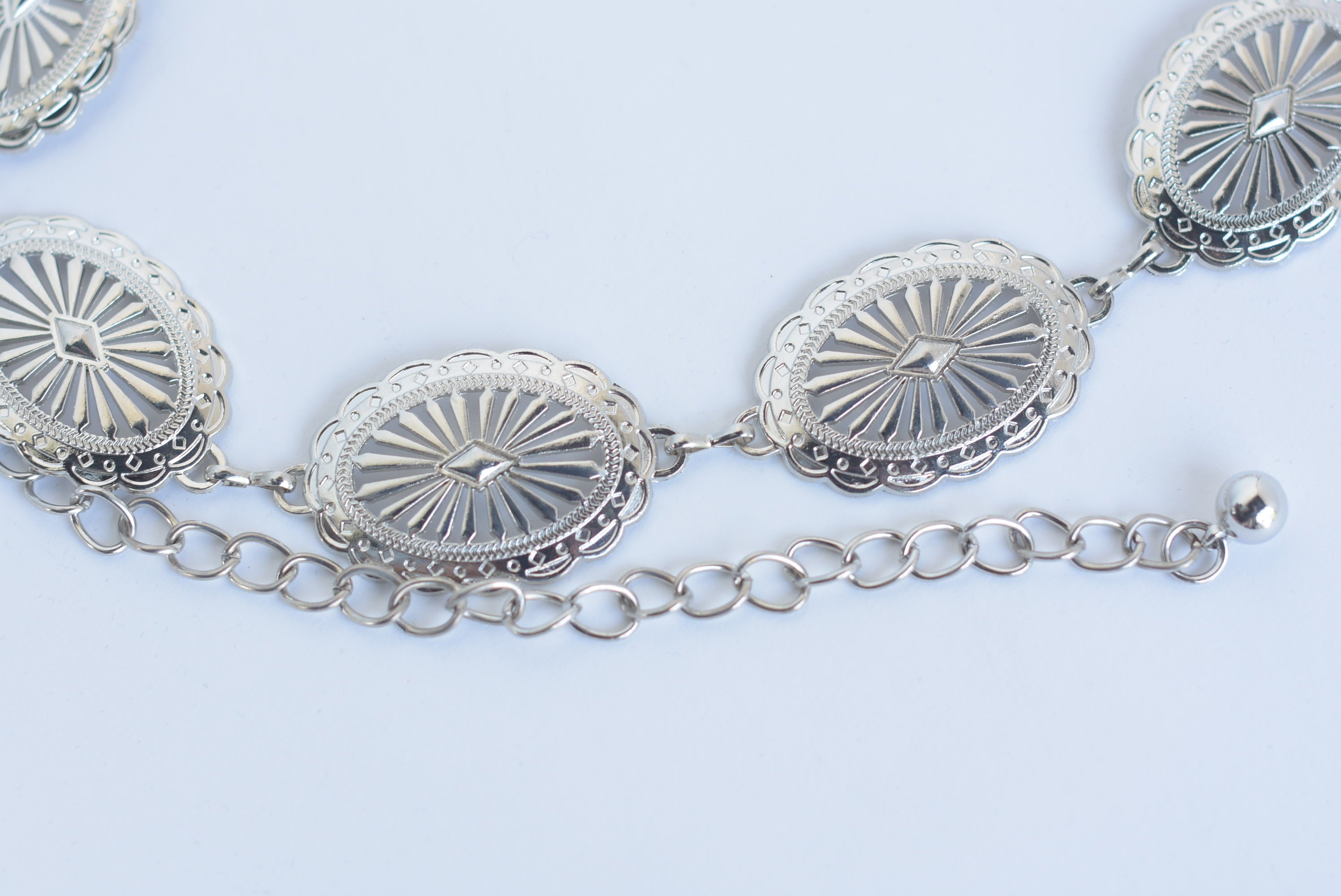 Cinturón metálico medallones