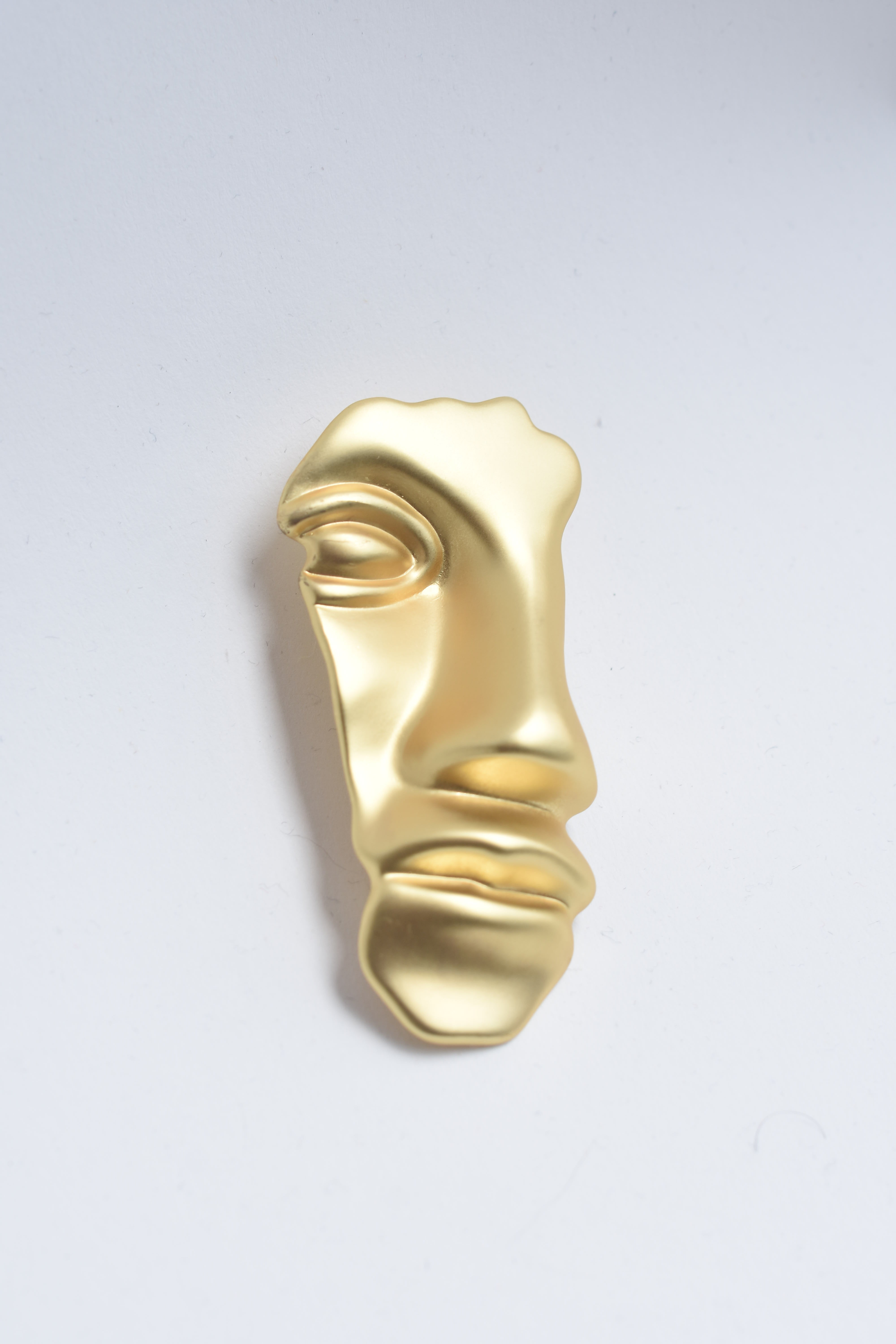 Broche rostro