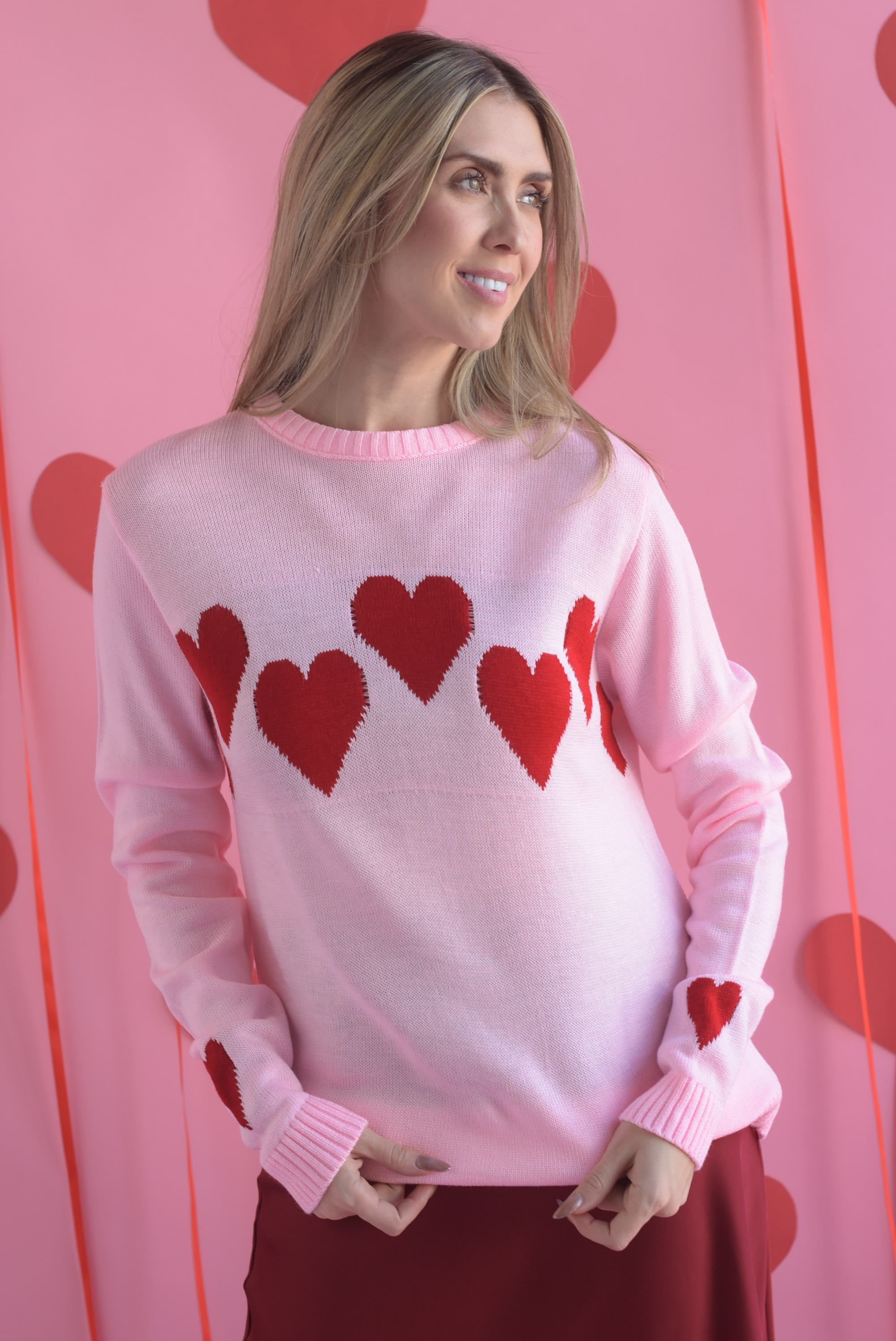 Sweater tira corazones