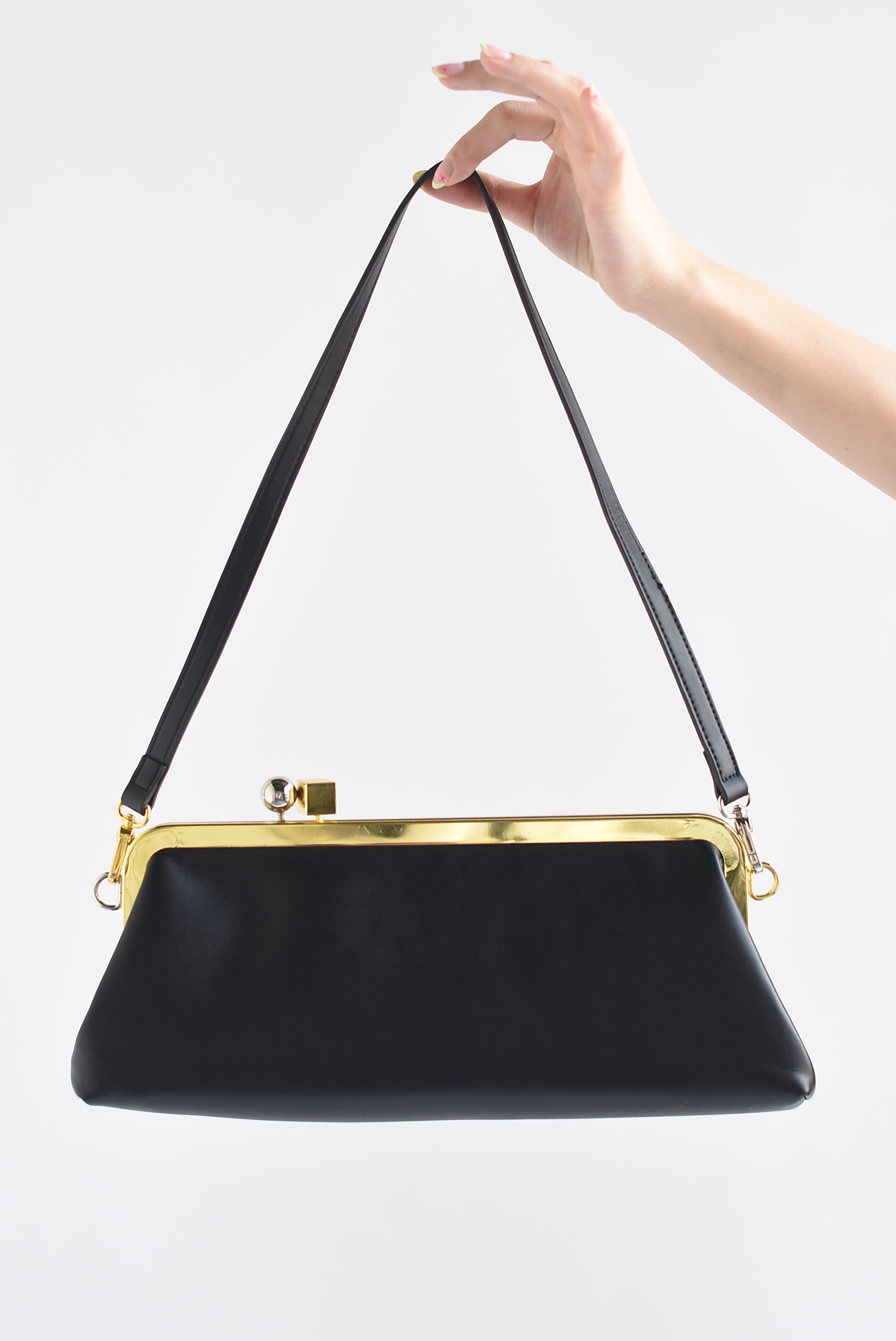 Bolso clutch broche dorado y plata