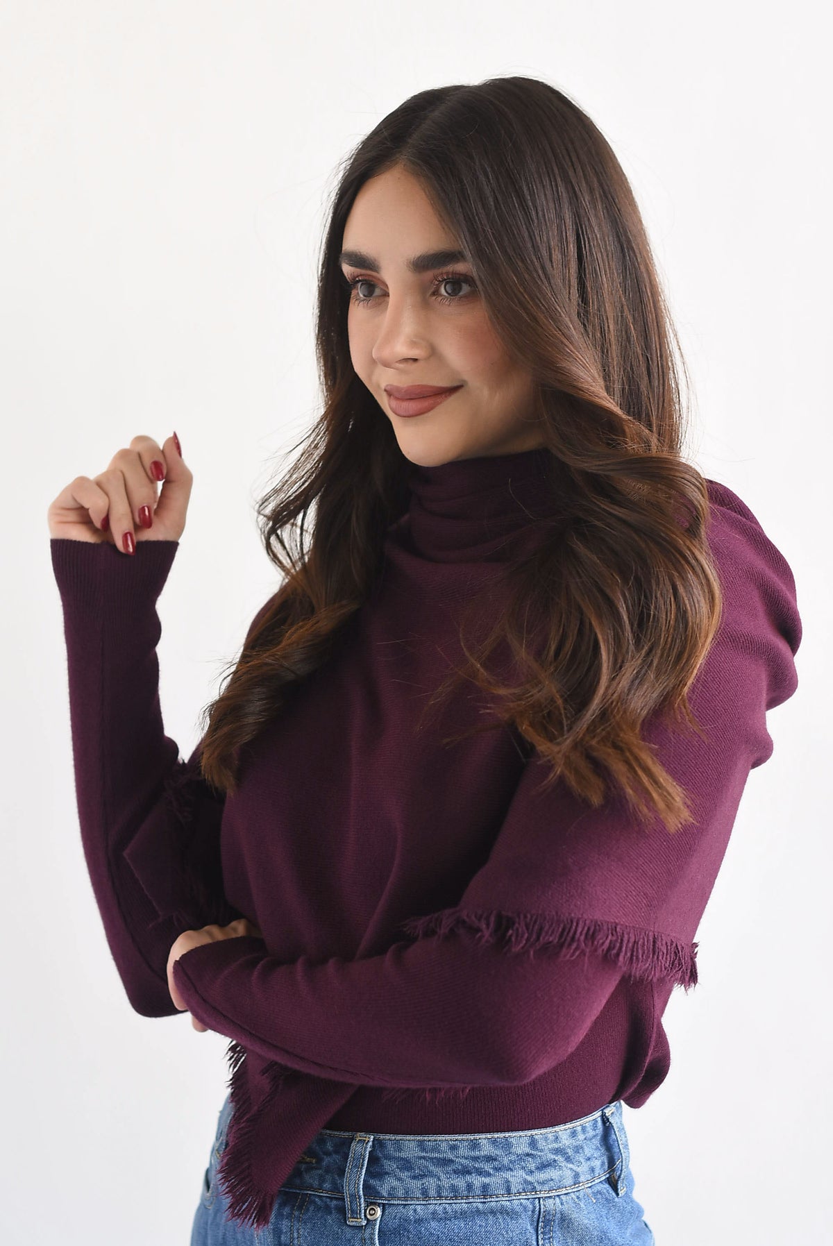 Sweater con capa