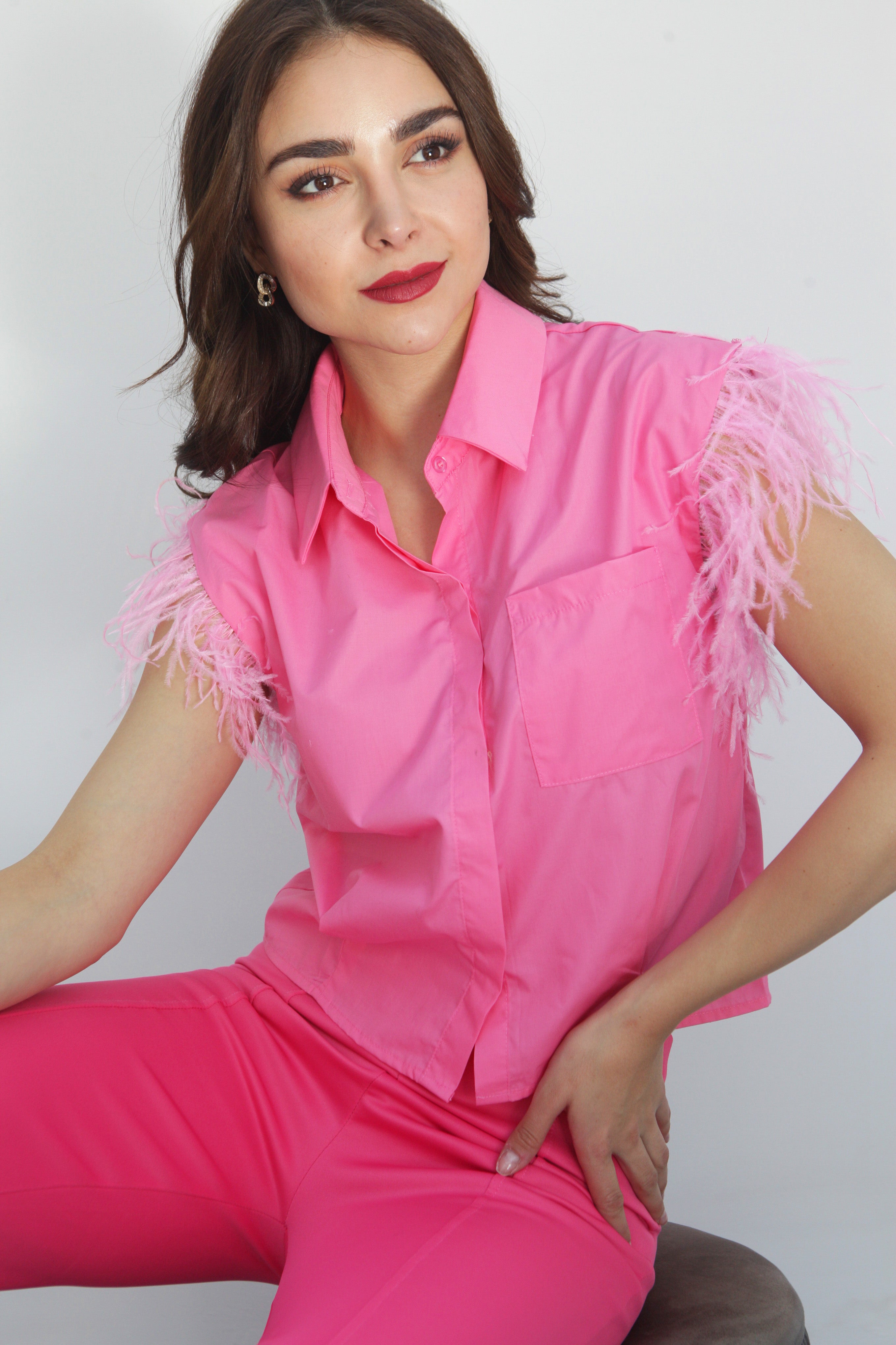 Camisa sin mangas plumas rosa Chicle