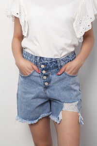 Fashion Styled Short de mezclilla tipo Mom desgarrado