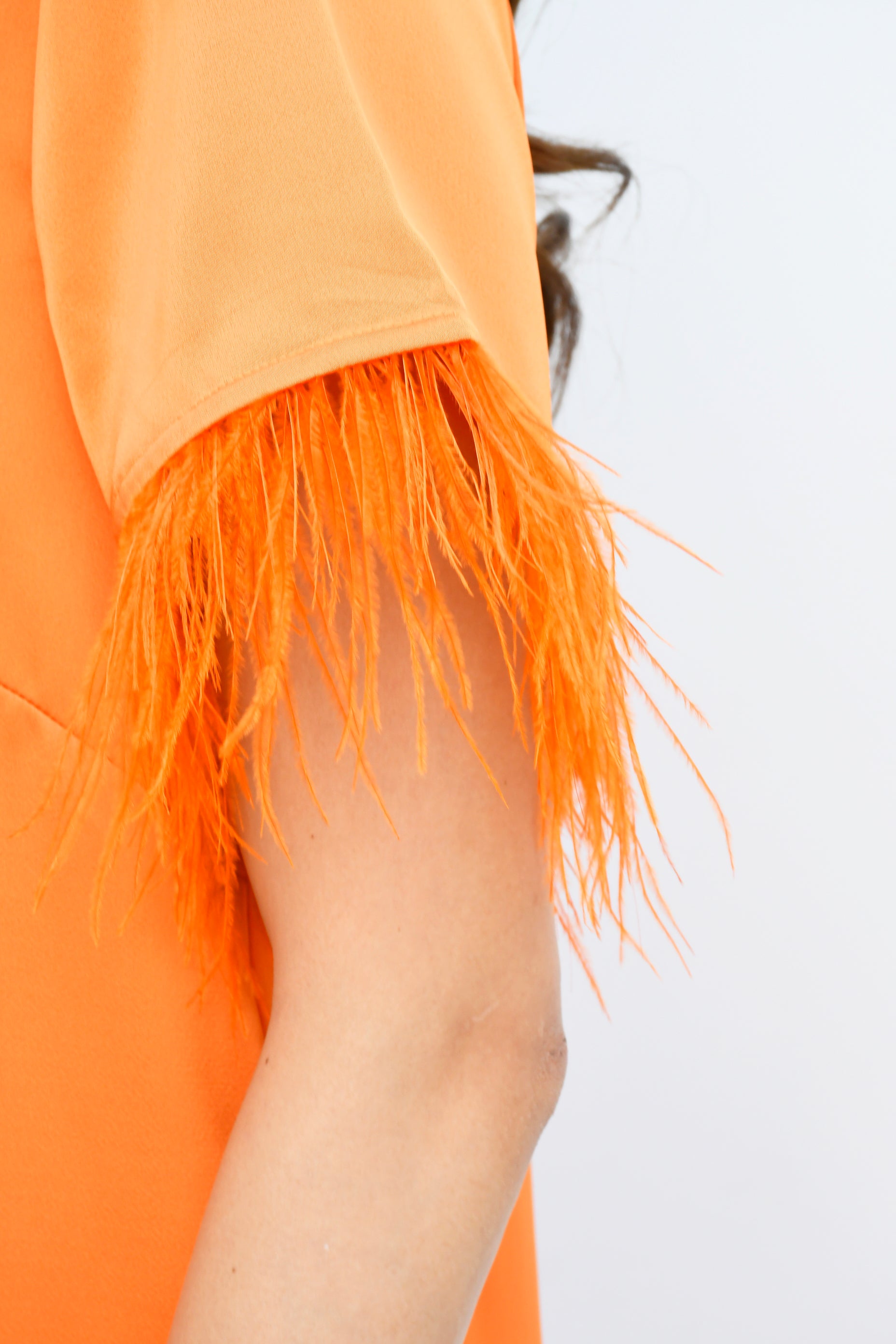 Blusa satín con plumas Naranja