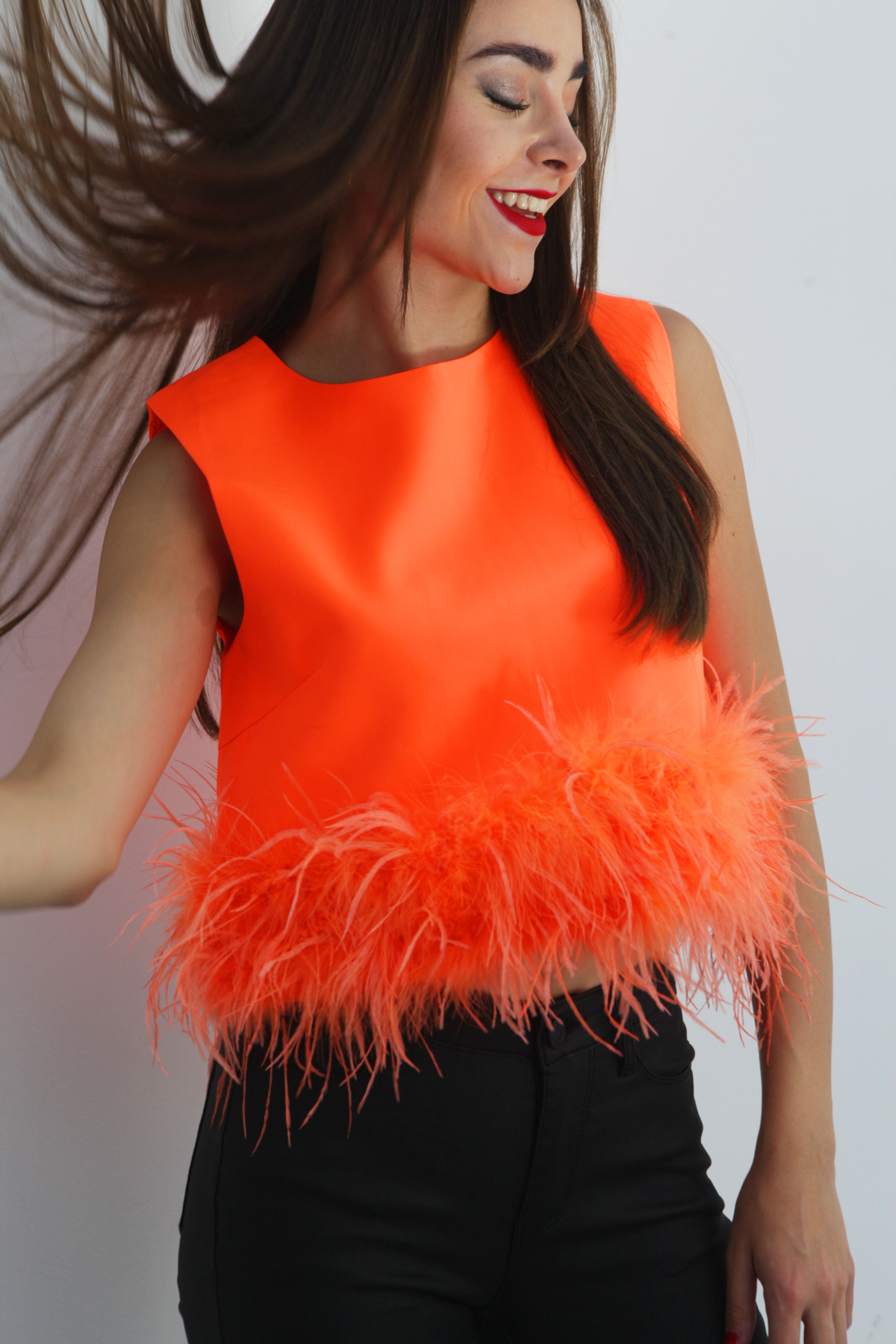 Blusa sin manga con Plumas Naranja Neón